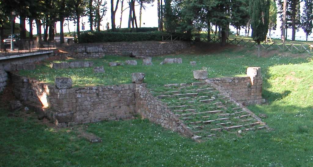 This is a photo of the ruins of the foundation of an Etruscan temple at Orvieto. The central stairway highlights the frontality of the temple that once stood at this site.