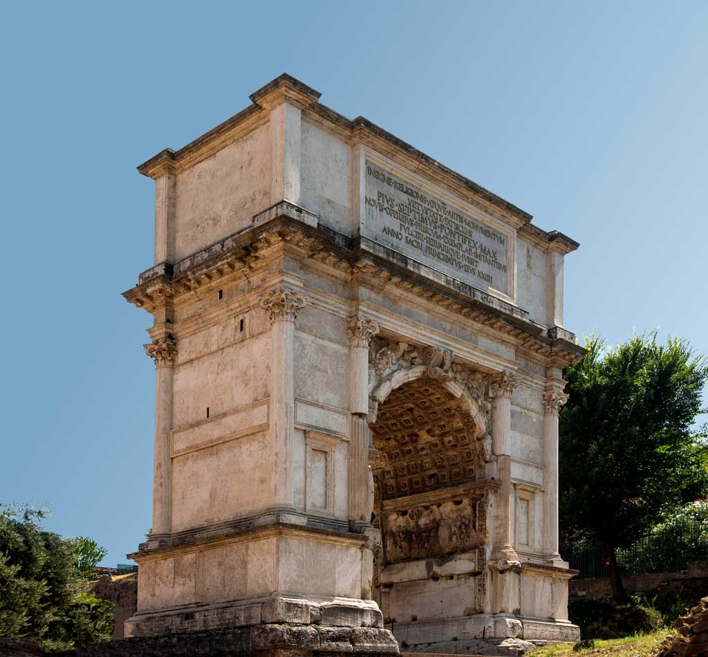 Picture of the Arch of Titus. The Arch is a two-column structure with a large archway within it. Atop the archway is an inscription which indicates that the arch was erected after the death of the emperor.