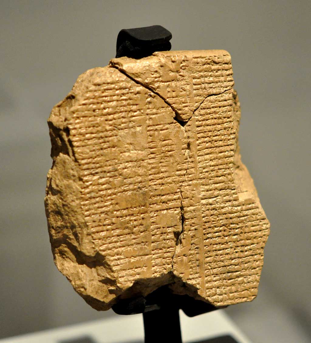 Brown textual fragment with the story of the Epic of Gilgamesh in cuneiform script.