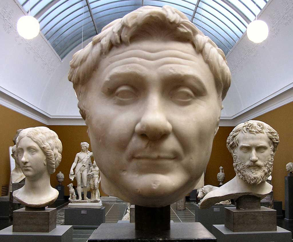 This photo shows a marble bust of Pompey the Great. Portraits of Pompey combine a degree of verism with an idealized hairstyle reminiscent of Alexander the Great.