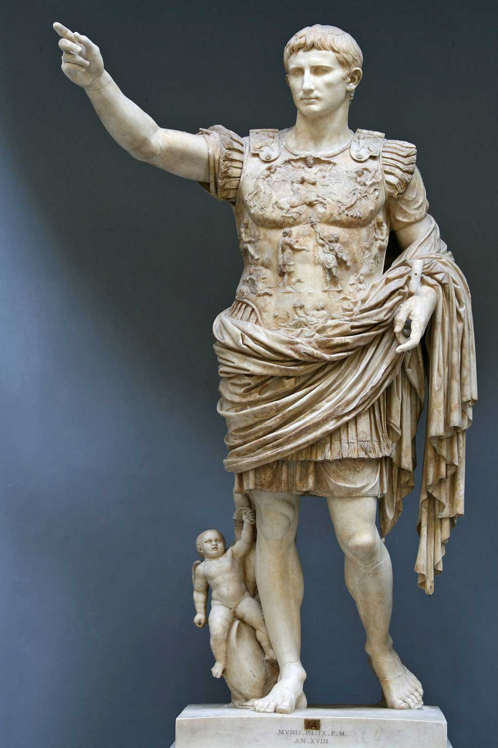 The Augustus of Primaporta statue shows the influence of both Roman and Classical Greek works. Cupid rides a dolphin at Augustus' feet, a symbol of his divine ancestry.