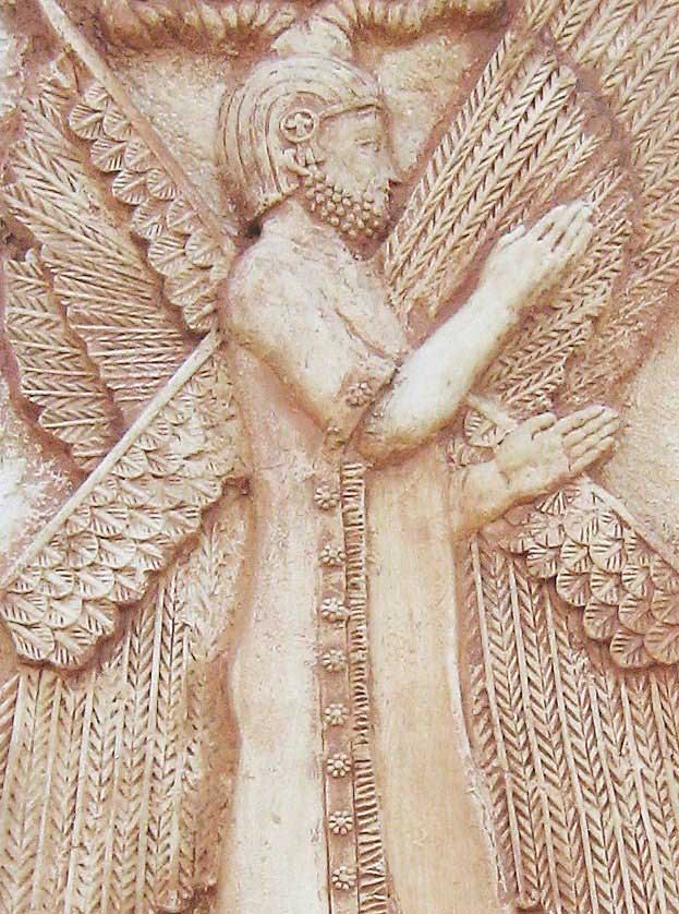 A two-dimensional tan stone relief of Cyrus the Great making a pronouncement with his hands.