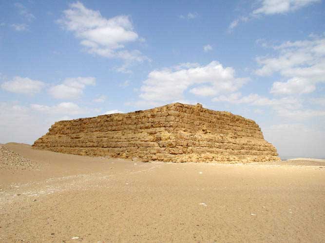 Remains of a real mastaba, standing alone in the desert.
