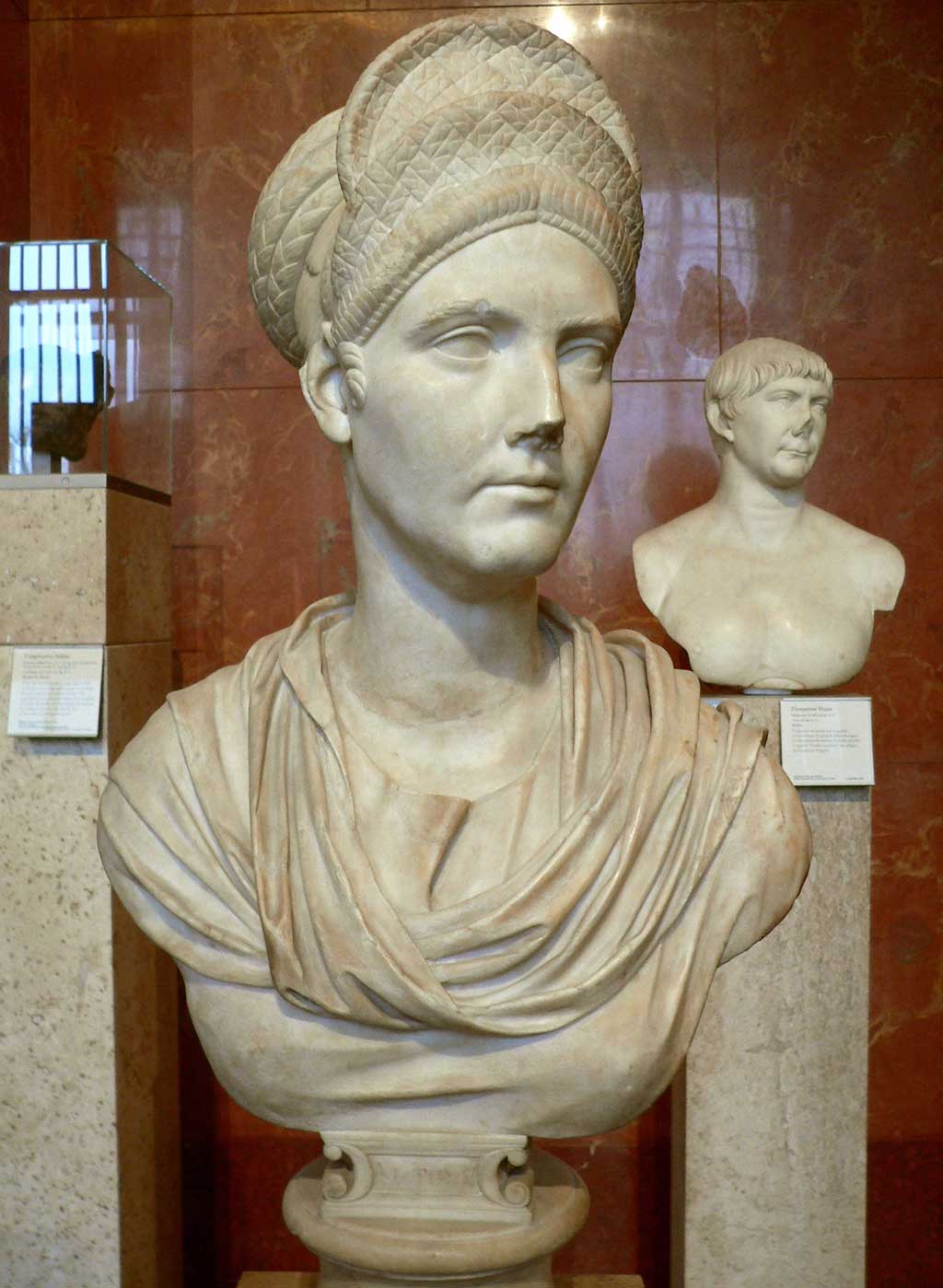 A bust of Trajan's Neice, Matidia. Like the Flavians, Matidia's hair stands in a stack, but unlike the Flavians, her hair stands in flat layers than in curls.