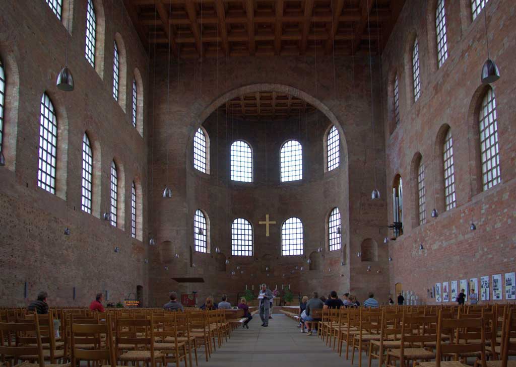 This is a picture inside the Aula Palatina. One sees within a simplified Roman basilica plan, consisting of a wide nave that ends in a north-facing apse.
