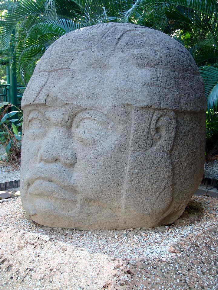 Photograph of a large stone head sculpture of an Olemec warrior