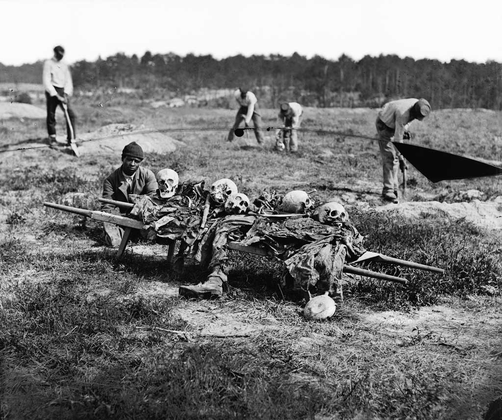 African Americans collecting bones of the soldiers killed in the battle at Cold Harbor, Va.