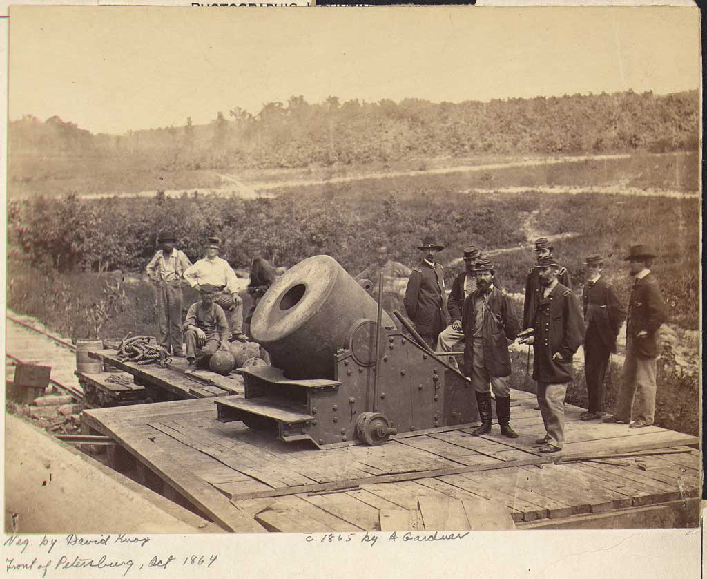 Group of soldiers standing around 'The Dictator,' a large mortar at Petersburg