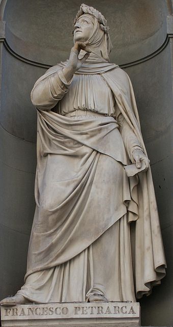 A photo of a full-body statue of Petrarch.