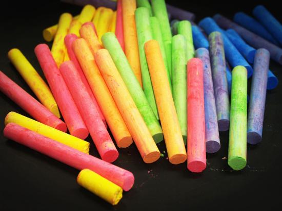 An array of brightly colored chalk for drawing