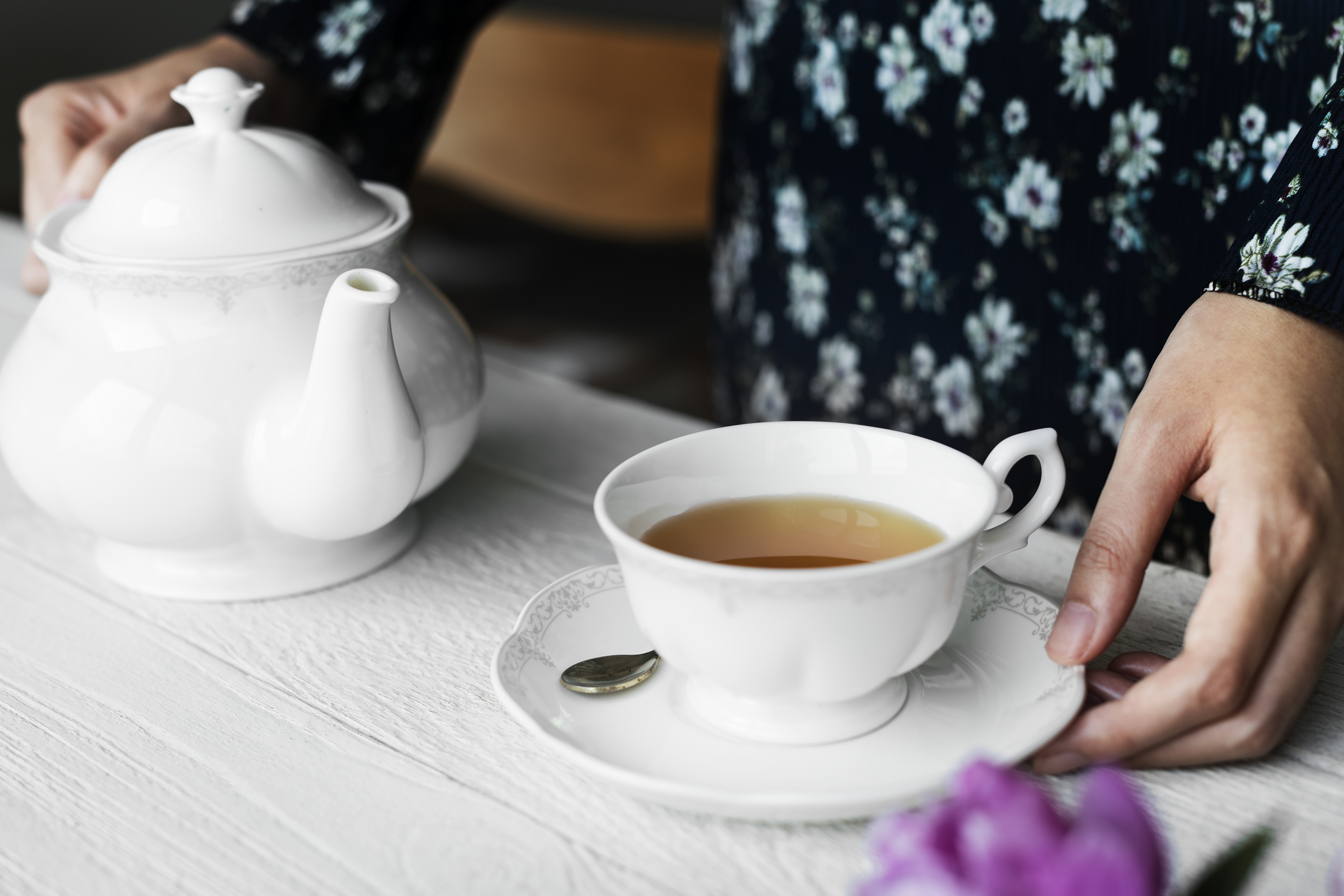 A person about to serve tea