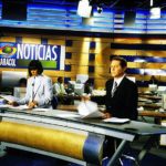 Newscasters reading the news for the Noticias program Caracol