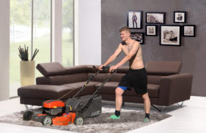 Young man mowing the carpet