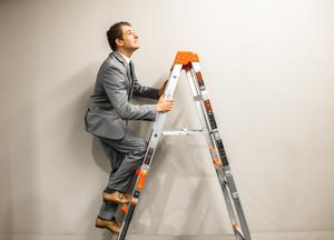 man climbing stepladder
