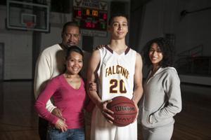 tall basketball player with his family