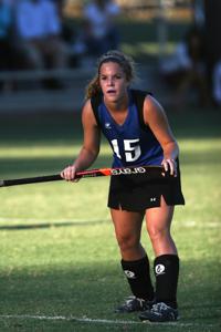young field hockey player with ponytail
