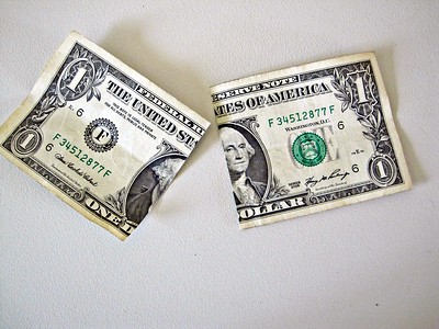 A dollar bill cut in half.