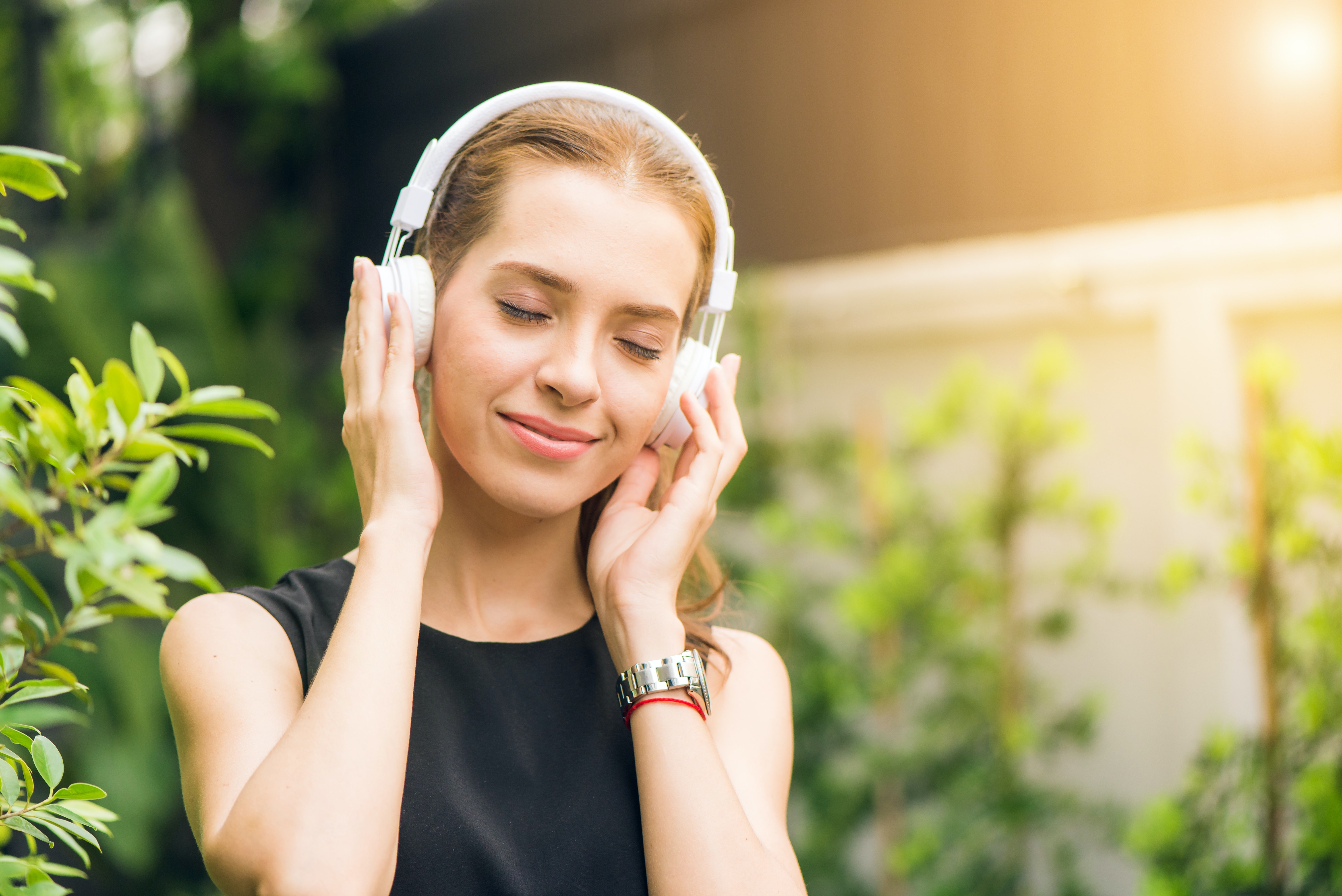 Girl listening to music with headphones.jpg