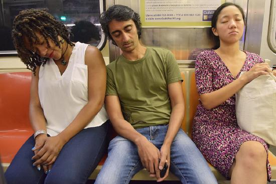People sleeping on the subway