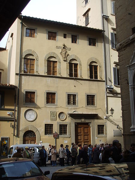 Palazzo dell'arte dei Beccai, the academy of arts in Florence a tall yellow building