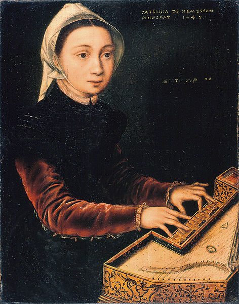 Girl playing the Virginal in a dark room 