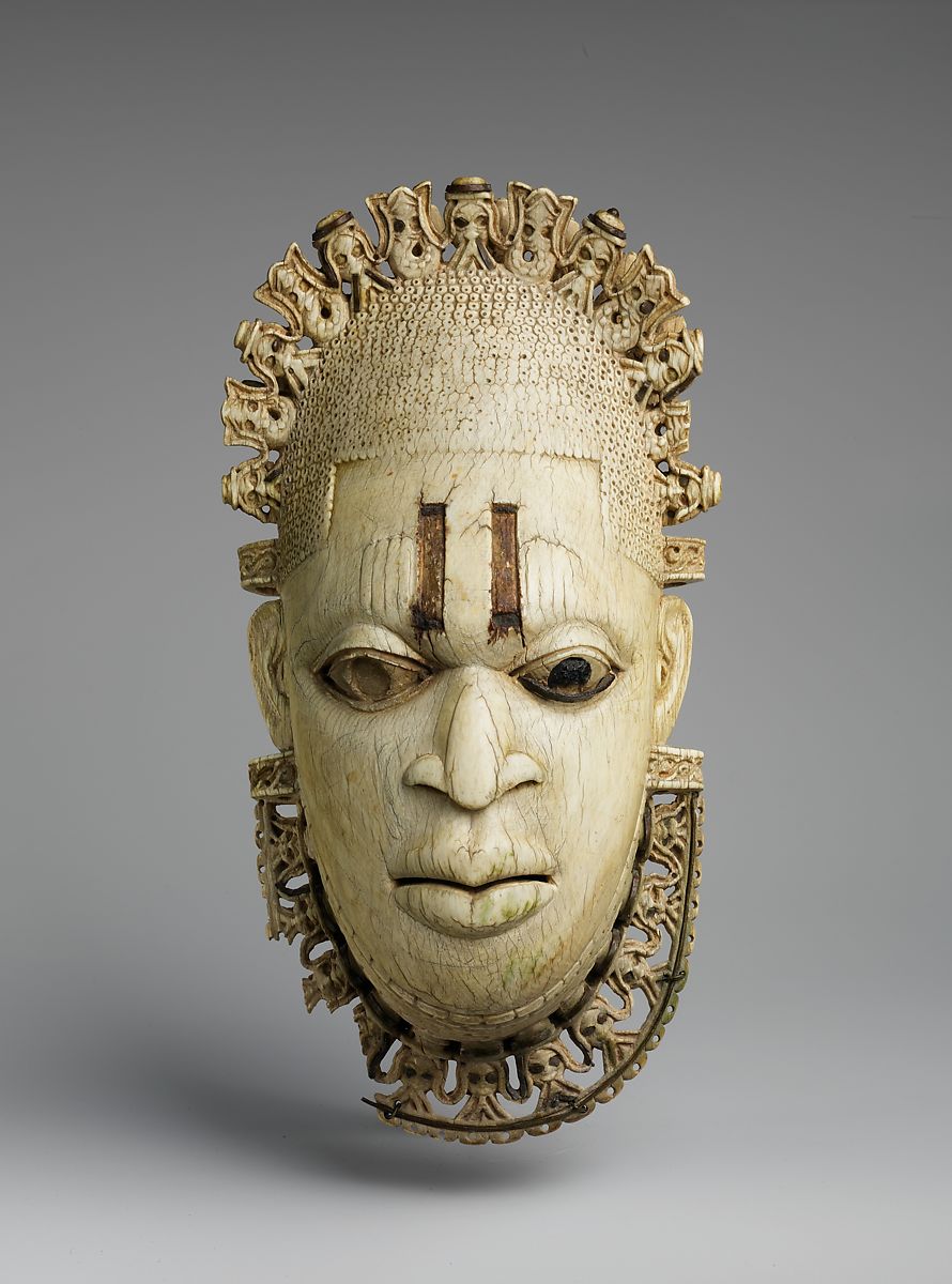 A Benin ivory pendant of a Oba mask