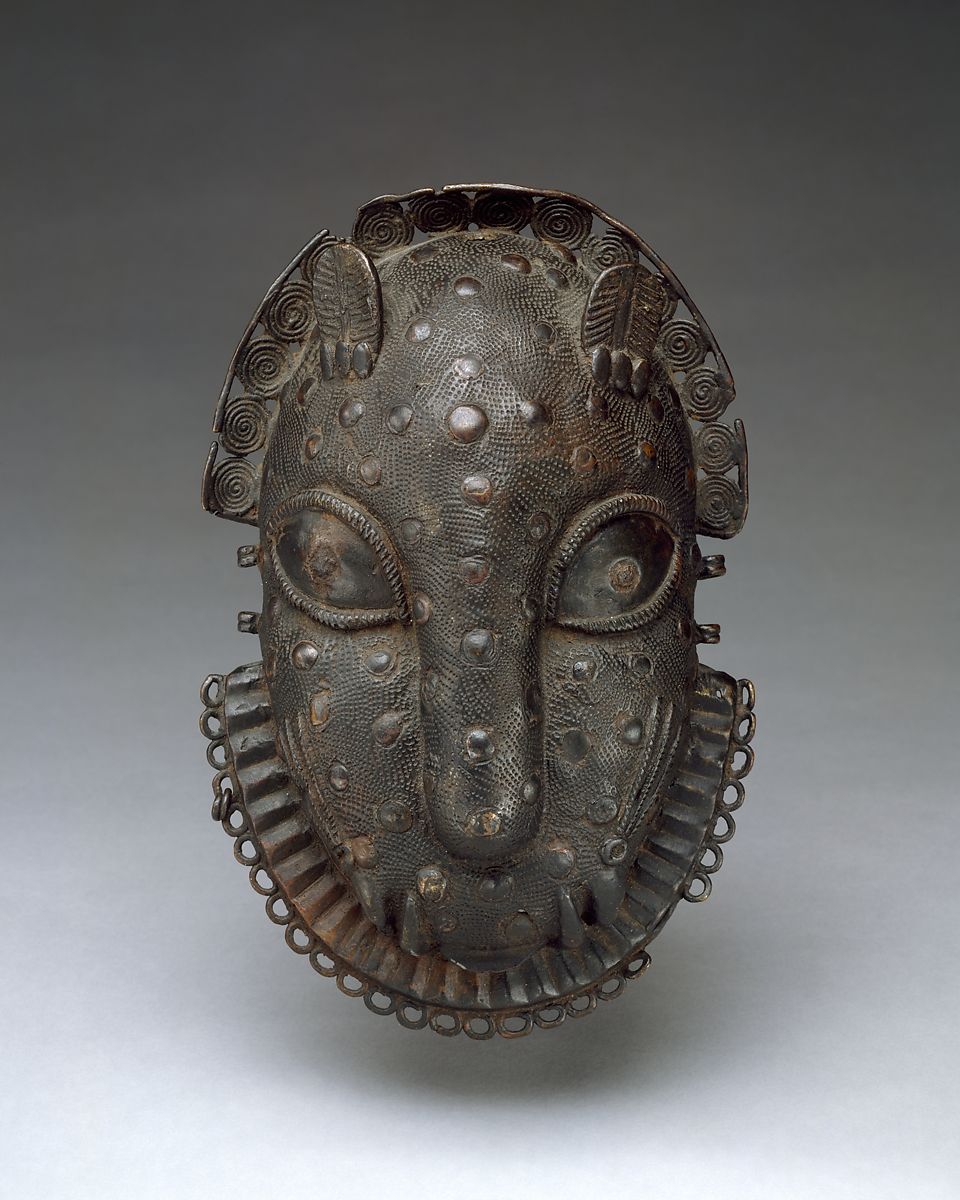 A Benin bronze hip ornament of a leopard head