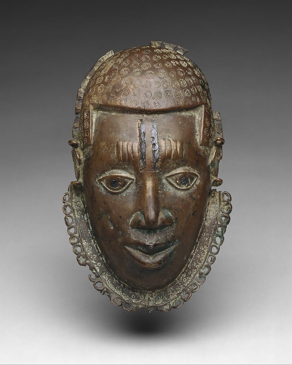 A Benin bronze mask of the oba king