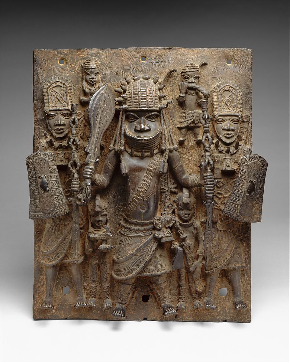 Benin cast bronze Oba walking in front with warriors on each side
