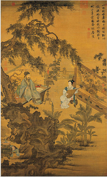 Una mujer tocando un instrumento frente a un hombre sentado en un banco rodeado de árboles