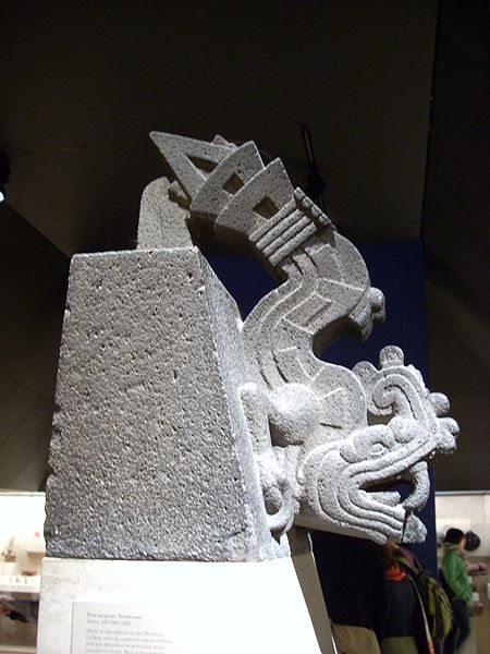 A sonte carving of a mythological serpent 