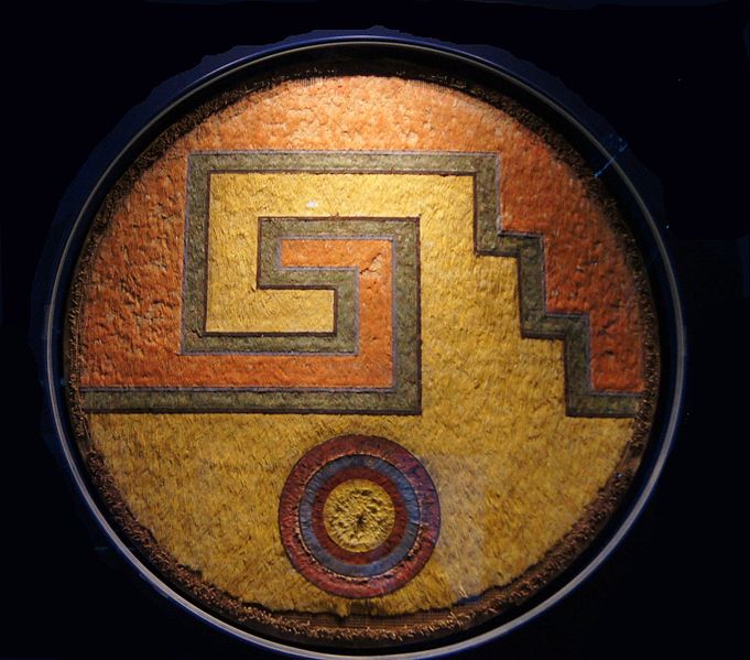 Feather shield in the shape of an Aztec symbol