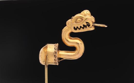 gold labret of a serpent with a long tongue