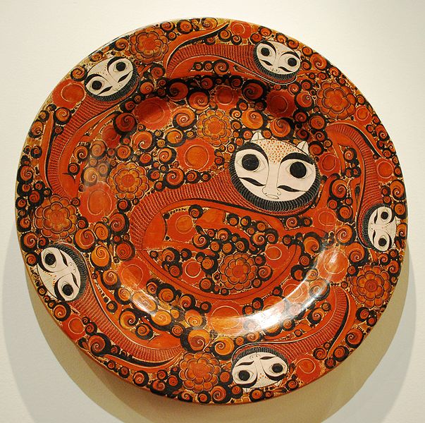Orange ceramic plate with symbols 
