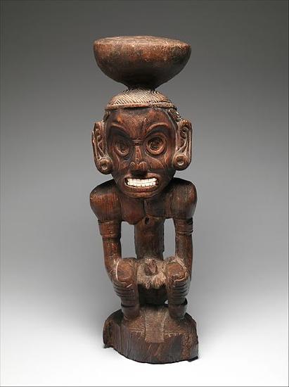 Deity figure made out of bronze with shell inlay