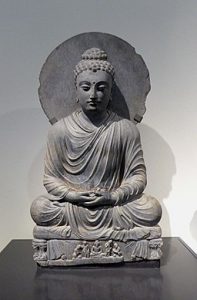 A statue of the Buddha meditating from Gandhara. Dated to the Kushan dynasty (200 to 400 CE). Now on display at the Victoria and Albert Museum in West London