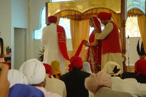 A Sikh couple getting married. Anand Karaj ceremony.