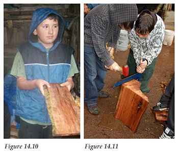 Student displays a cedar plank; students practice making cedar planks
