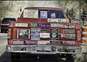 Truck with many political bumper stickers