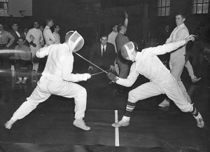 Black and White photo of two people fencing