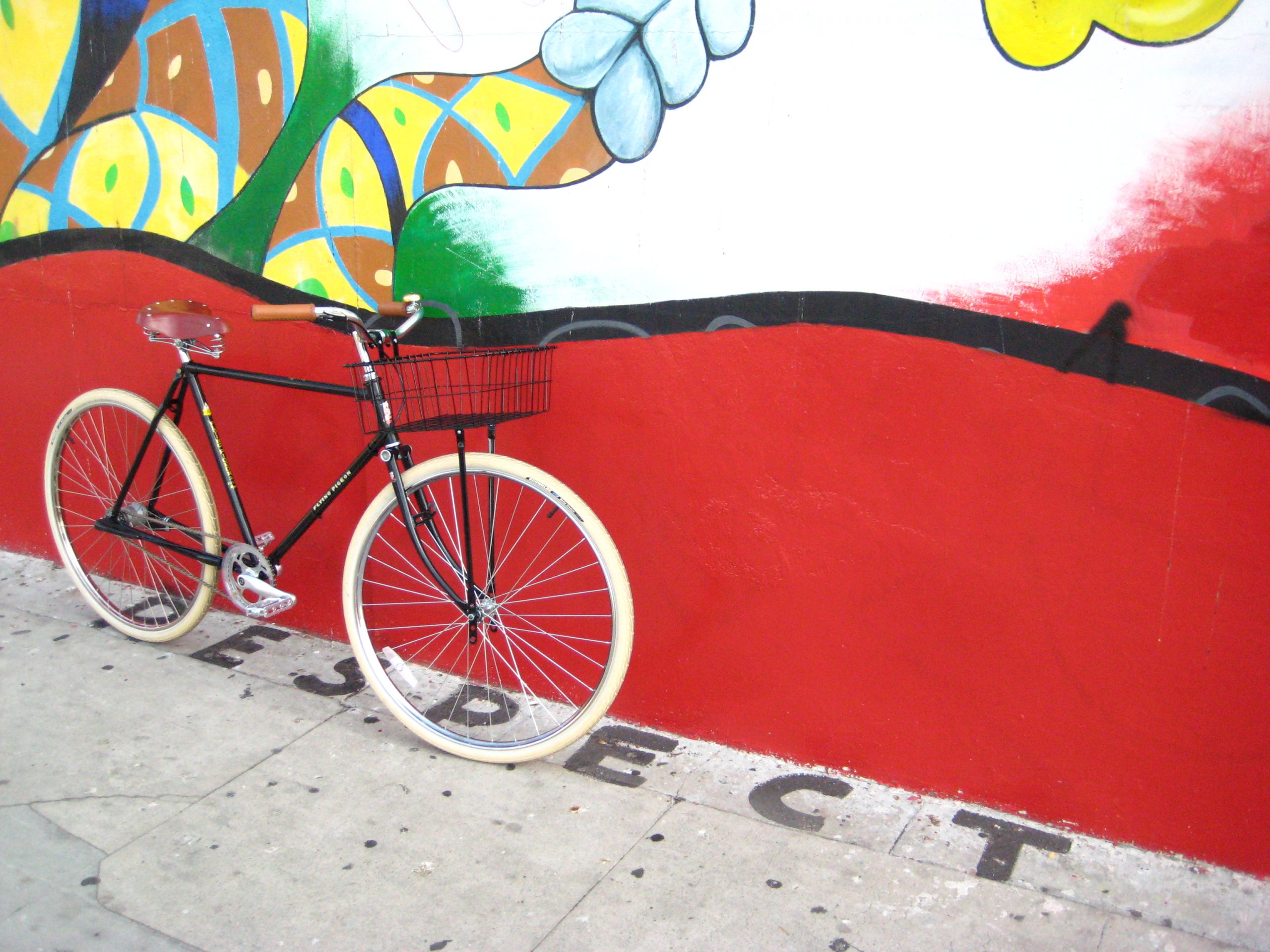 Bicycle against colored wall