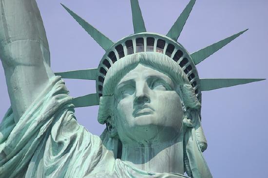 Closeup of the Statue of Liberty's face and headgear.