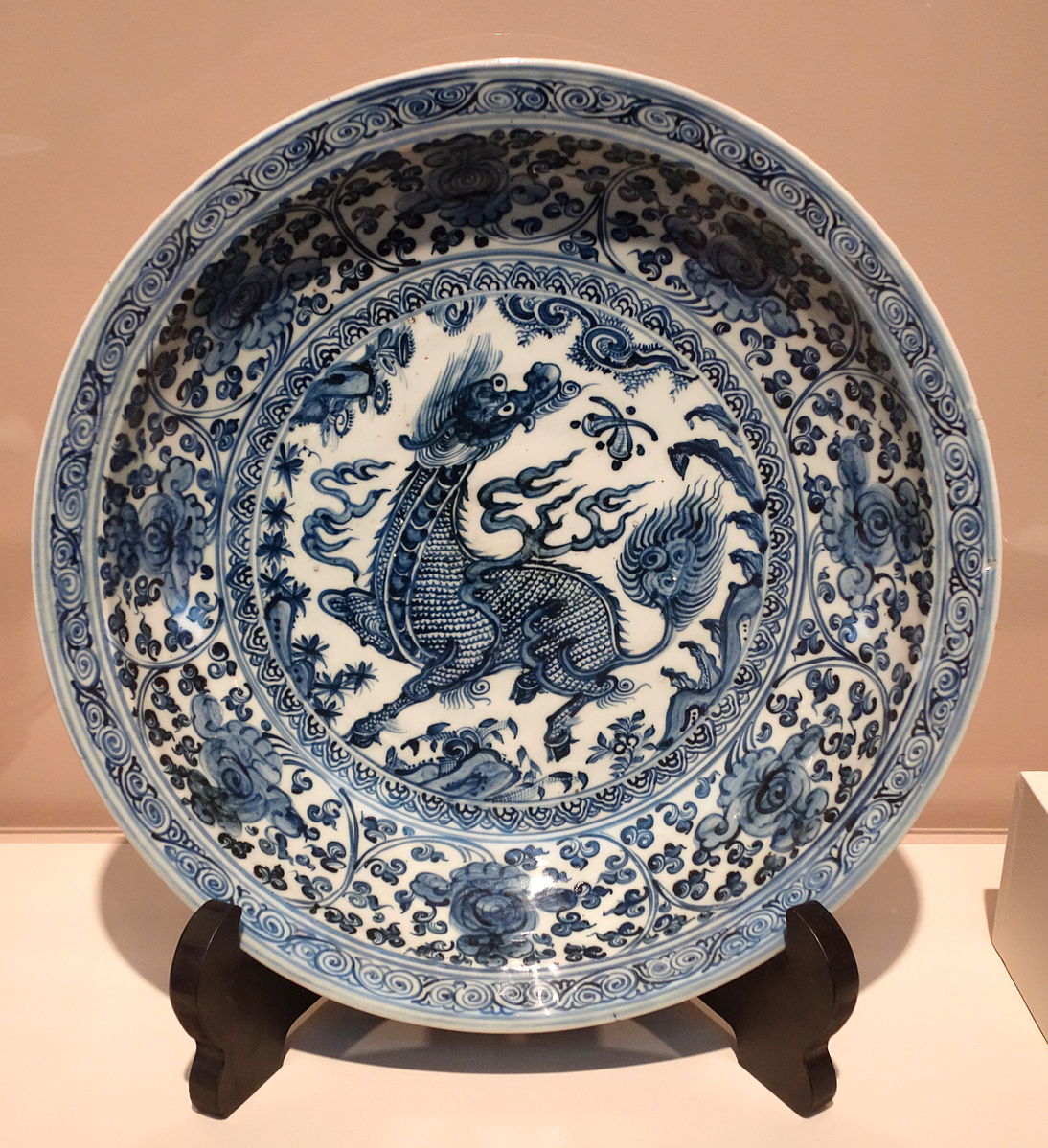 Ming porcelain plate with blue and white painting of a dragon