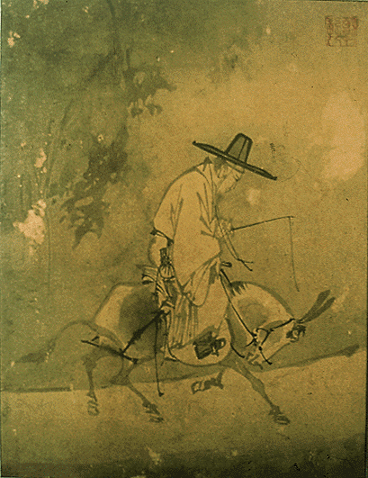 a man on a horse riding through the country