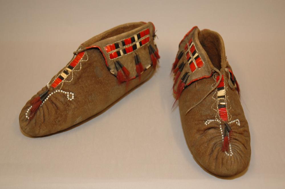 A pair of moccasins made of leather and beaded 