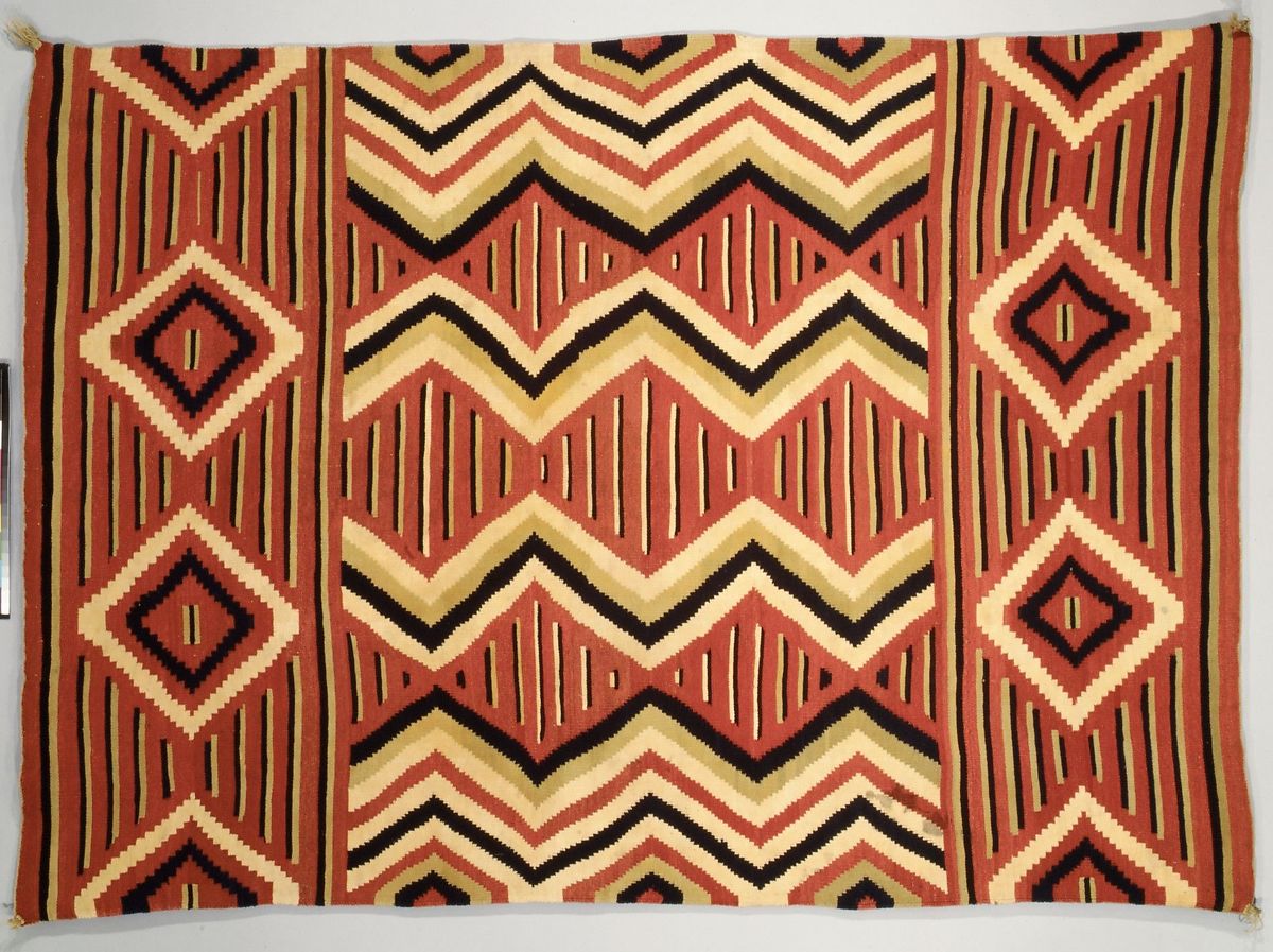 Navajo warring blanket with triangles and stripes woven in bright colors