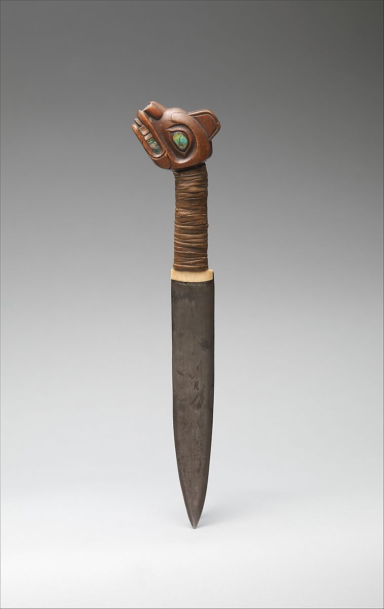 Dagger made of iron, a wooden carved head, and bound together by leather 