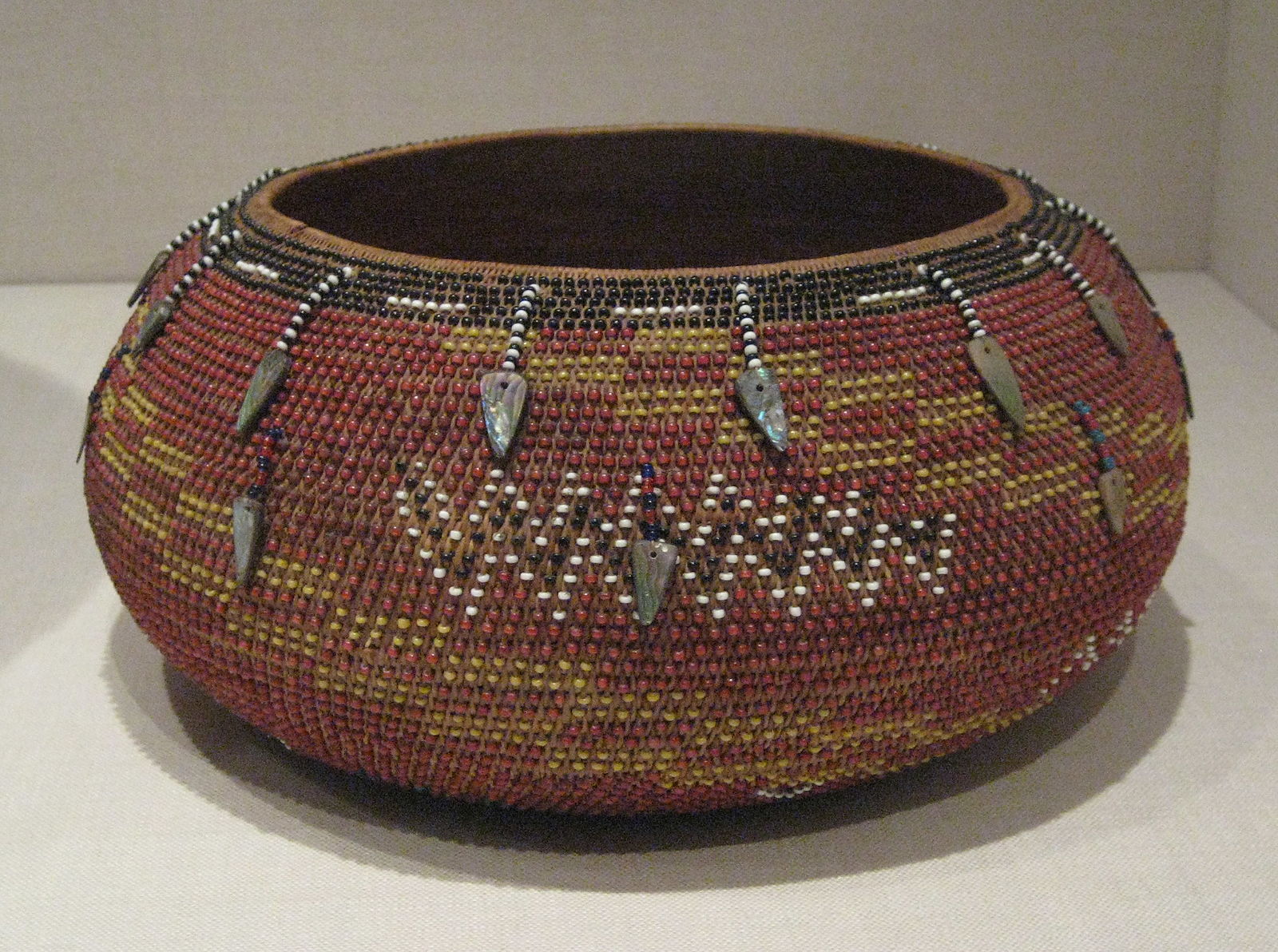 Basket bowl women with inserted glass beads and abalone shells 
