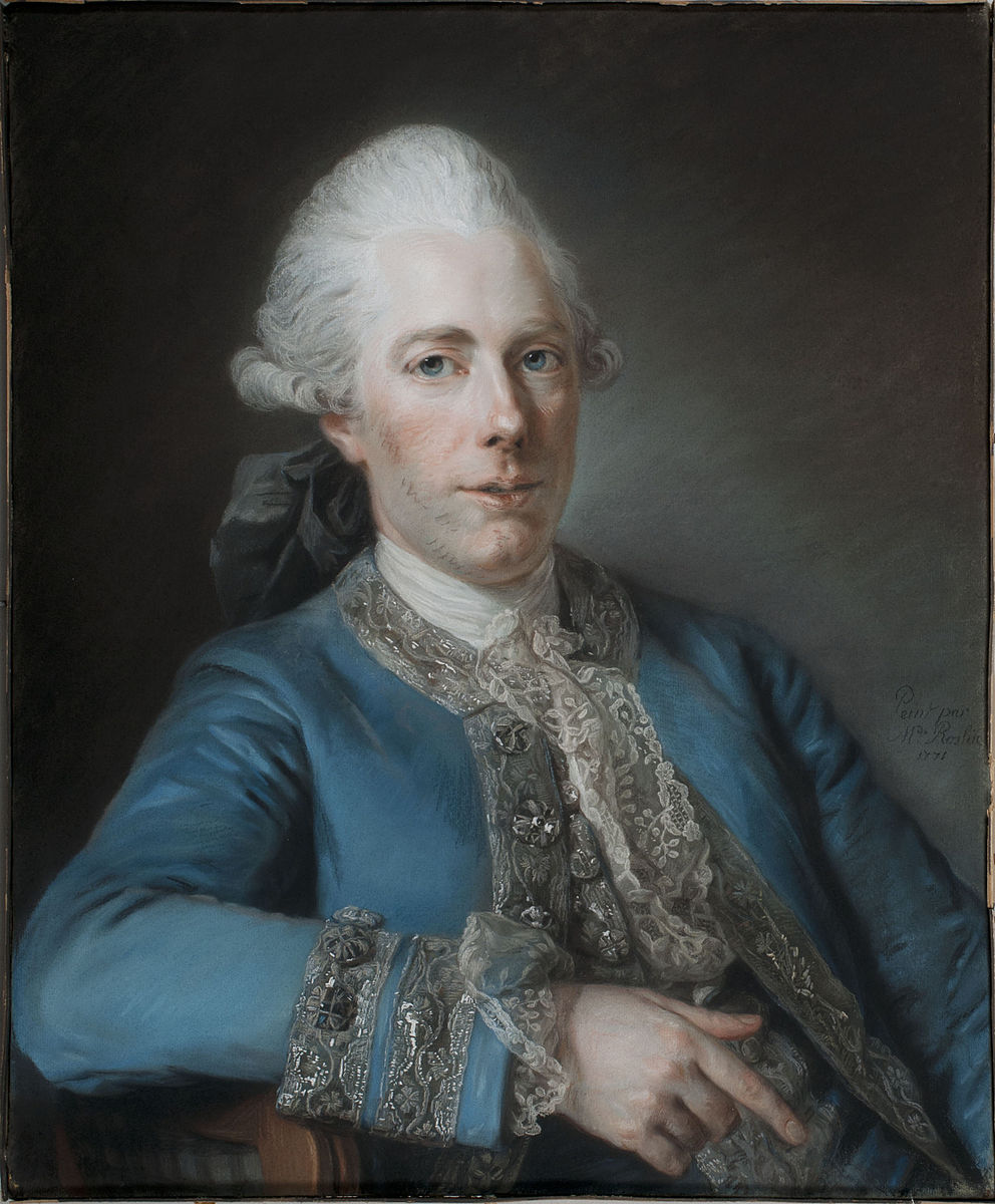 a man with white hair wearing a blue silk jacket and a white shirt