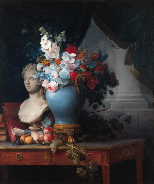a blue vase sitting on a wood table next to a marble bust 